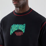 Netflix Stranger Things Eleven Short Sleeve Oversized Cotton T-Shirt in Black